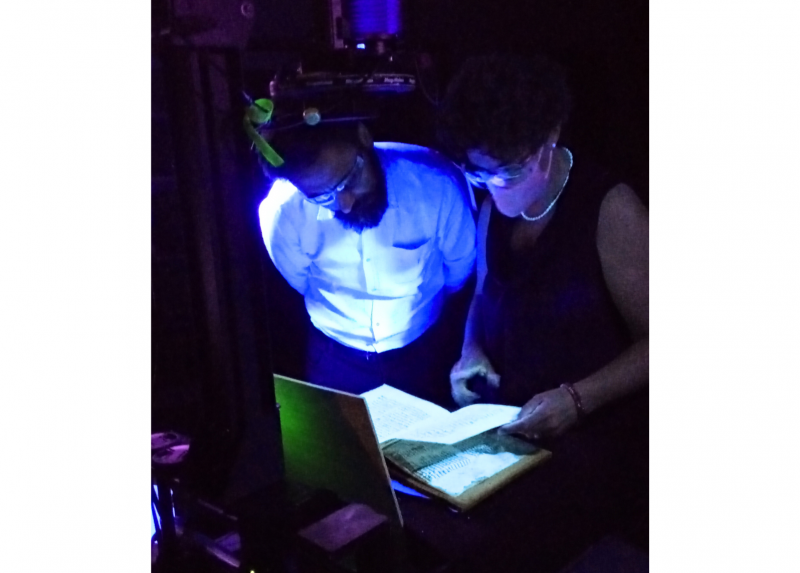 Instructors of the Department of Historical Studies at work on a manuscript
