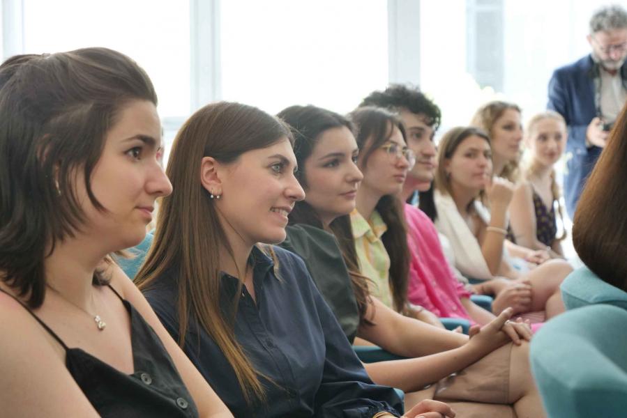 A group of students attend the meeting with Pierpaolo Piccioli